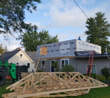 Second story addition framed with room gables on the ground
