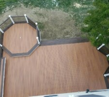 Drone view of large brown custom shape wooden desk